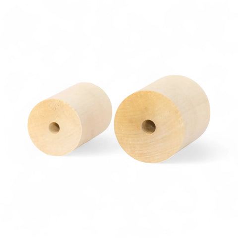 koka cilindri in 40 × 60 mm un 50 × 60 mm izmēri sakrauti kopā