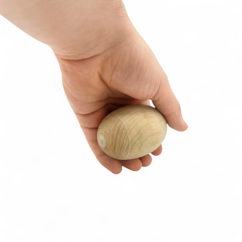 50 mm Birch Wood Egg Shape Ellipsoid Block held in hand for size comparison