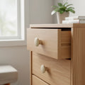 59 mm round wooden cabinet knob installed on cabinet door